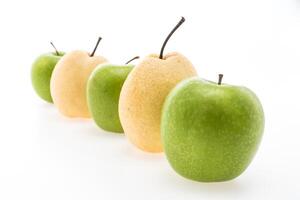 A row of green apples and pears photo
