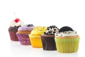 A row of cupcakes with different flavors photo