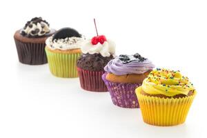 A row of cupcakes with different flavors photo
