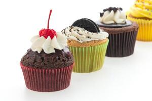 A row of cupcakes with different flavors photo