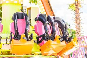 A ride with a bunch of seats on it photo