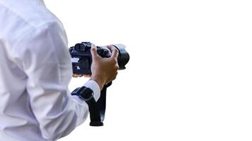 A detailed close-up of hands gently cradling a sleek black camera, symbolizing creativity and the art of capturing moments, set against a minimalist white background photo