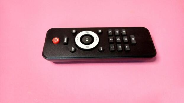 Generic black remote control for electronic devices. Concept of technology, entertainment, and control. photo