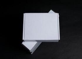Two boxes stacked on top of each other at a slight angle photo