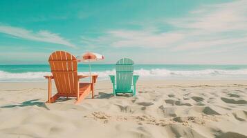 Two chairs situated on a sunny beach near the ocean photo