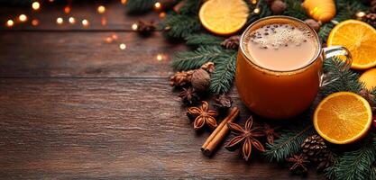A mug of hot chocolate is surrounded by cinnamon sticks and oranges. The image conveys a cozy and warm atmosphere, perfect for a cold winter day photo