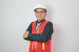 Site supervisor crossing his arms at a construction site. photo