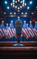 A microphone is on a wooden podium in front of a backdrop of American flags. The microphone is black and shiny, and it is the focal point of the image. The flags behind the microphone are red, white photo