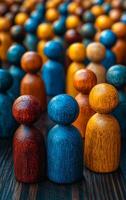 Vibrant display of colorful wooden figures. Wooden figures in various colors stand closely, creating a lively pattern on a dark background in soft lighting. photo