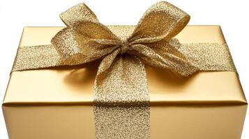 A gold wrapped gift box with a gold ribbon tied around it. The ribbon is gold and shiny, and it looks like it's been carefully wrapped around the box photo
