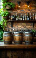 Three barrels of wood sit on a counter in front of a brick wall. The barrels are wooden and have a rustic appearance. The scene is set in a bar, with bottles photo