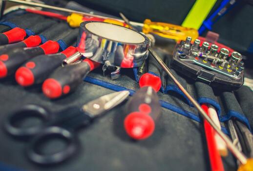 Various Tools Arranged Neatly on a Workbench Ready for Repair Tasks in a Workshop photo