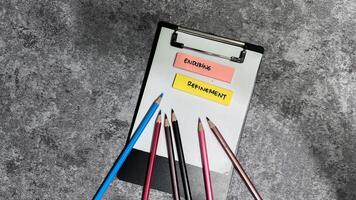 Concept of Enduring Refinement write on sticky notes isolated on Wooden Table. photo