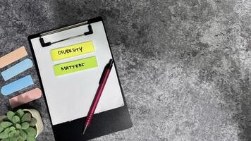 Concept of Diversity Matters write on sticky notes isolated on Wooden Table. photo