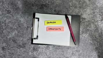 Concept of Problem crossed out and opportunity write on sticky notes isolated on Wooden Table. photo