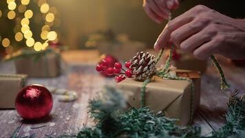 hand makes bow on Christmas present video
