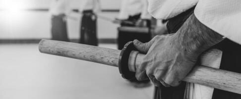 Person practicing aikido in a dojo background. photo
