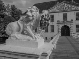 A statue of a lion in front of a building photo
