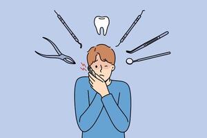 Man suffers from pain in teeth and appearance of caries, stands among dental instruments vector