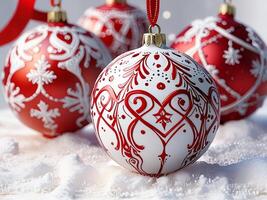 A red and white christmas ornament with a tree in the background photo