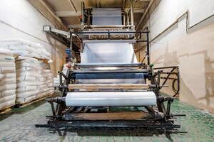 Future of Innovation A Glimpse into the Intricate Machinery of Plastic Film Production, Showcasing Precision and Technological Advancement. photo