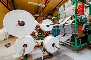 Where Texture Meets Innovation The Heart of Textile Production Unraveled with Giant Rolls of Endless Possibilities. photo