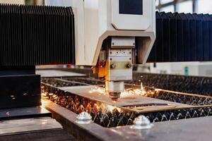 Intricate Precision A Laser Cutting Machine Carves Patterns into Metal, Emitting Fiery Sparks Against a Backdrop of Technology and Innovation. photo