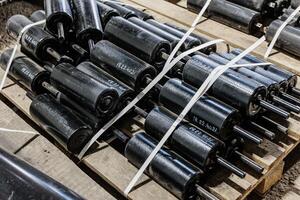 Industrial Harmony A Stacked Symphony of Conveyor Rollers Ready for Action, Showcasing Efficiency in Motion. photo