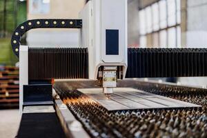 Precision in Motion A Laser Cutting Machine Sculpting Metal with Artistry and Accuracy, Creating Intricate Designs in Real-Time. photo