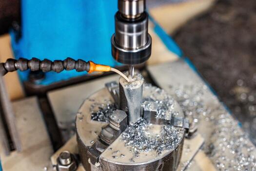 Precision in Progress A milling machine etches metal with a mist of coolant, showcasing the perfect balance of innovation and engineering craftsmanship in action. photo
