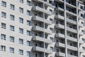 Beneath Skies of Serenity A Modern Multi-Story Haven with Inviting Balconies Offering Glimpses of Life Above. photo