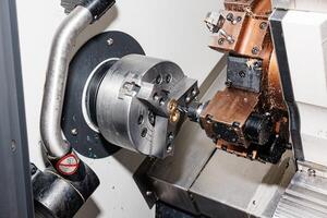 Precision Crafting in Motion A CNC Lathe Machine Carves Perfection with Spinning Metal and Robotic Precision. photo