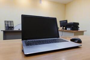 Seamless Focus A Modern Workspace with a Sleek Laptop and Precision Mouse, Illuminated by Soft Natural Light. photo