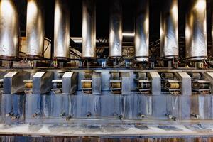 Intricate Machinery A Symphony of Columns and Rollers in an Industrial Landscape, Showcasing the Power of Modern Engineering. photo