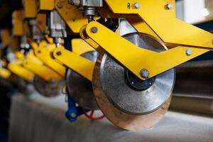 Precision in Motion The Intricate Dance of Circular Blades within a Robust Industrial Cutting Machine photo