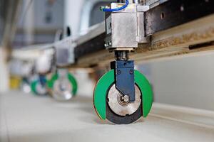 Precision in Motion A glimpse into a cutting machine deftly slicing through vibrant materials, showcasing the artistry of technology and craftsmanship. photo