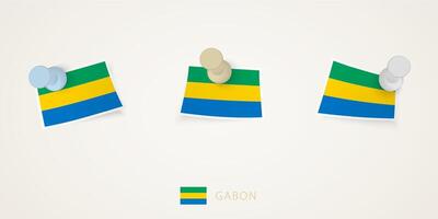 Pinned flag of Gabon in different shapes with twisted corners. pushpins top view. vector