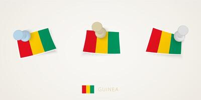 Pinned flag of Guinea in different shapes with twisted corners. pushpins top view. vector