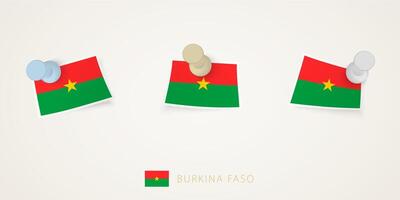 Pinned flag of Burkina Faso in different shapes with twisted corners. pushpins top view. vector
