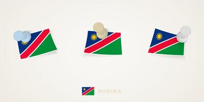 Pinned flag of Namibia in different shapes with twisted corners. pushpins top view. vector