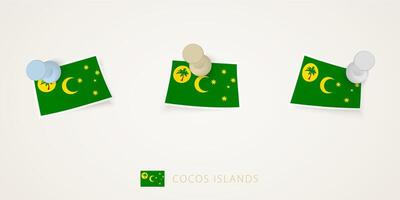 Pinned flag of Cocos Islands in different shapes with twisted corners. pushpins top view. vector