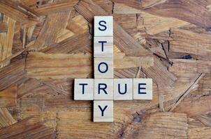 true story text on wooden square photo