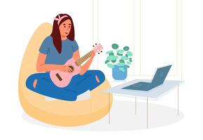 Cute Teenage Girl Sitting In Bean Bag Chair With Lags Crossed Learning To Play Ukulele Online. Young Woman Singing And Playing Ukulele. photo