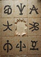 a mosaic floor with several different religious symbols on it photo