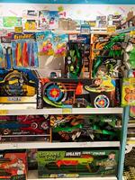 Kyiv, Ukraine - November 20, 2024 Colorful toy store display with archery and glider sets on shelves photo