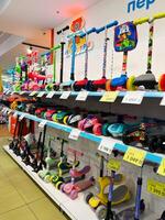 Kyiv, Ukraine - November 20, 2024 Colorful array of scooters on display in a toy store photo