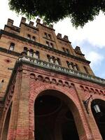 Historic architectural brick building with ornate arches and windows. Chernivtsi, Ukraine. photo