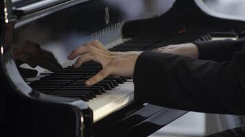 An Enchanting Pianist Showcasing Talent While Performing Beautifully on Grand Piano. Clip photo