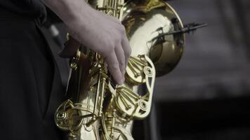 A Close Up of a Talented Saxophonist Playing Captivating Jazz Music on Stage Live. Clip photo