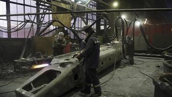 An Industrial Workshop where Workers Fabricate various Metal Components for production. Stock Clip photo
